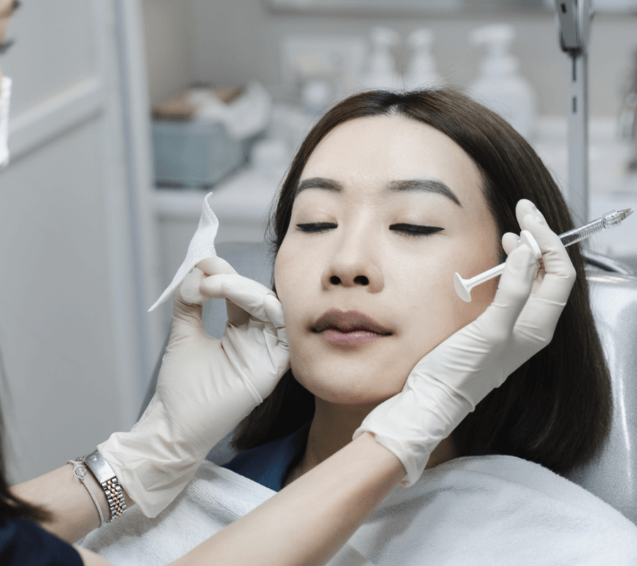 My doctor assessing my face before my filler treatment